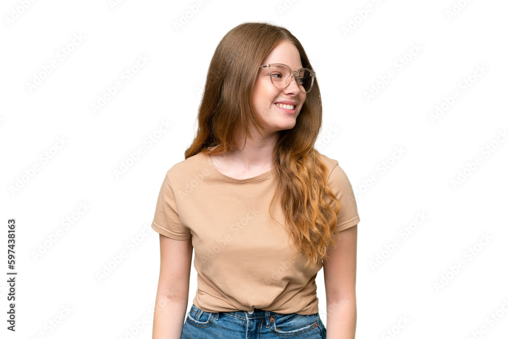 Young pretty woman over isolated background looking to the side and smiling Young pretty woman over isolated background looking to the side and smiling