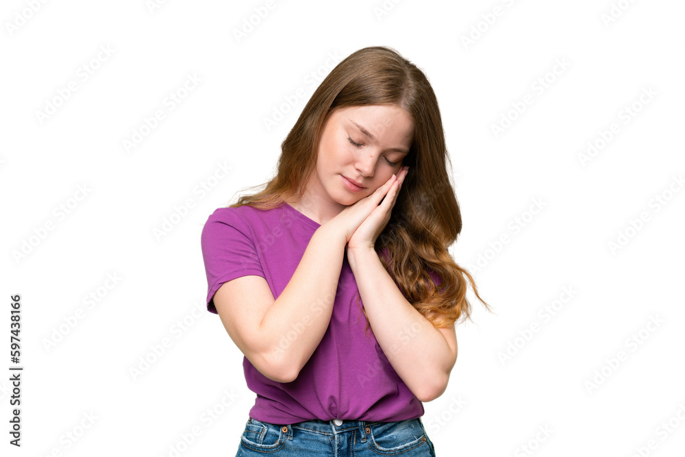 Young pretty woman over isolated background making sleep gesture in dorable expression Young pretty woman over isolated background making sleep gesture in dorable expression