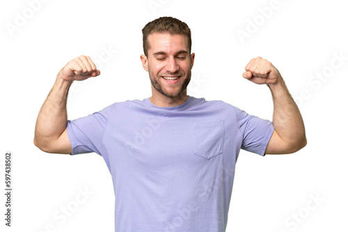 Young handsome caucasian man isolated on green chroma background doing strong gesture © luismolinero