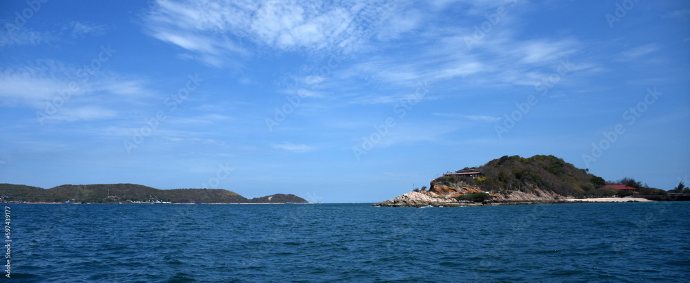 Thailand Pattaya Ko Lan beach. A beautiful shot of an empty sunny beach. Beach white sandy beach. Water waves made from boats are mountainous background. Thailand Pattaya Ko Lan beach. A beautiful shot of an empty sunny beach. Beach white sandy beach. Water waves made from boats are mountainous background.