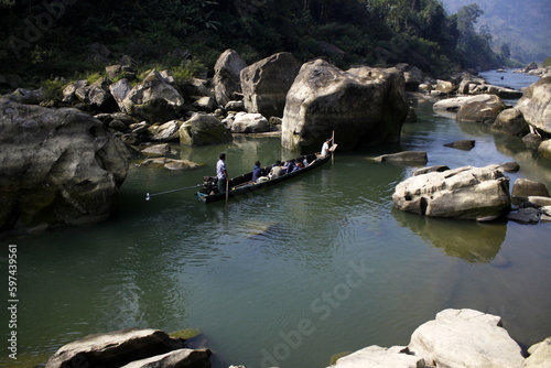 Tanchi, Bandarban, Bangladesh-8 Jan 2015: Life in Bandarban with the natural beauty. People use engine boats as transportation. Life beside Sangu River. the most remote district of Bangladesh.