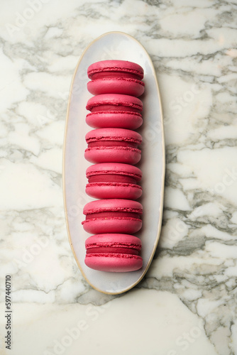Pink macarons on marble background. Strawberry macarons