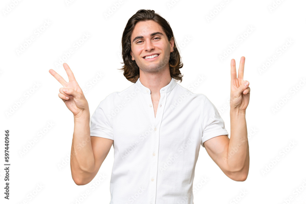 Young caucasian man isolated on green chroma background showing victory sign with both hands Young caucasian man isolated on green chroma background showing victory sign with both hands