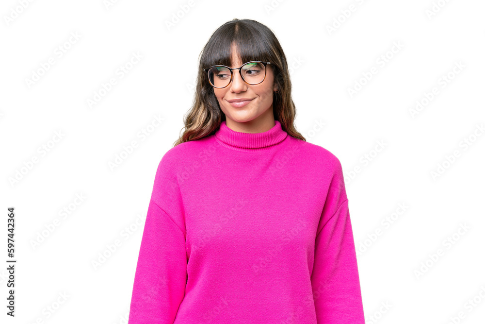 Young caucasian woman over isolated background having doubts while looking side