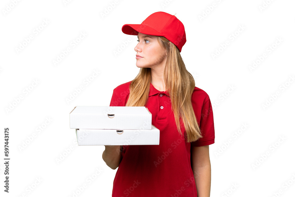 Young caucasian pizza delivery woman with work uniform picking up pizza boxes over isolated background looking to the side Young caucasian pizza delivery woman with work uniform picking up pizza boxes over isolated background looking to the side