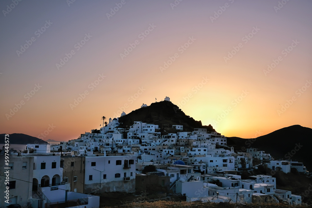 Panoramic view of the beautiful village of Ios Greece and an amazing sunset in the background