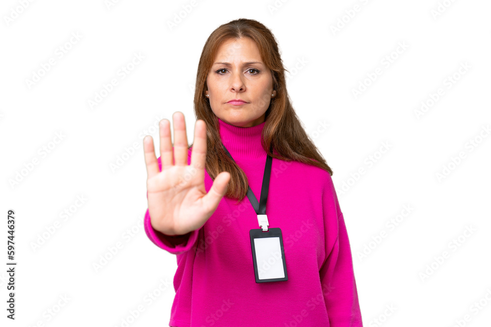 Middle-aged caucasian woman with ID card over isolated background making stop gesture Middle-aged caucasian woman with ID card over isolated background making stop gesture