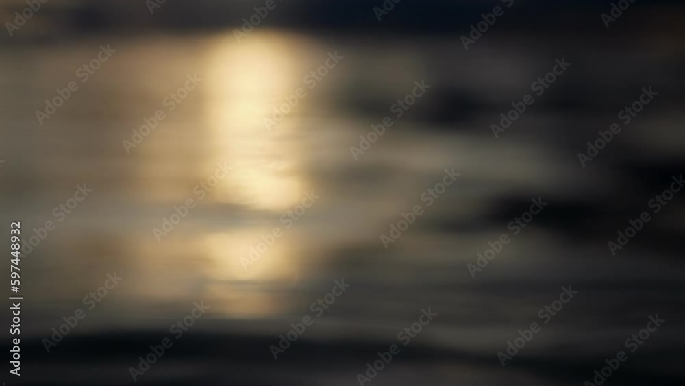 Cameras just above the water surface, the sun is rising. We see the edge of the water, we dive under the water. Sea surface at sunset.
