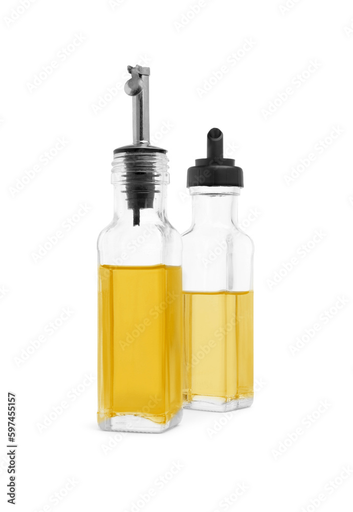 Glass bottles of cooking oil on white background