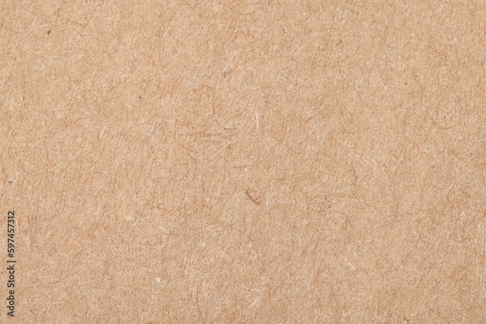 Fototapeta premium Texture of beige paper sheet as background, top view