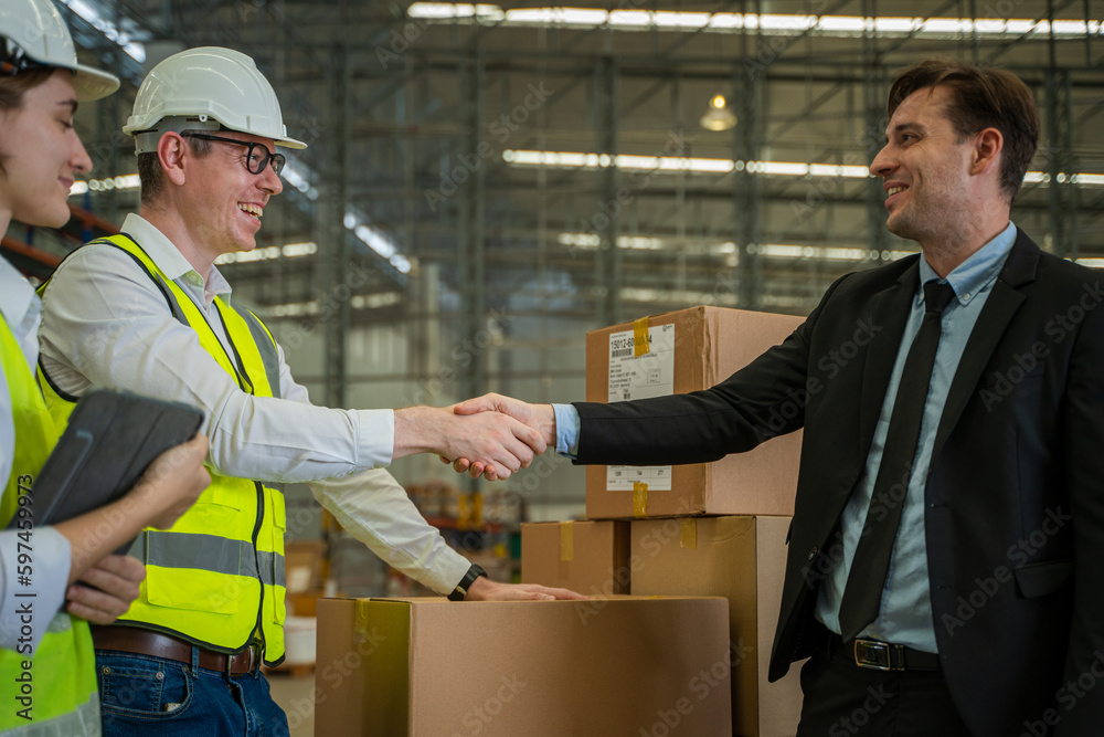 Meeting at warehouse,Warehouse managers with warehouse workers have a briefing in a large distribution center,Concept of teamwork and occupation.