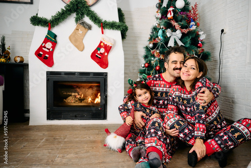 Family wearing matching Christmas pajamas