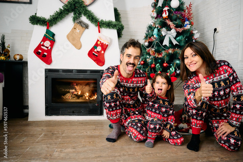 Family wearing matching Christmas pajamas