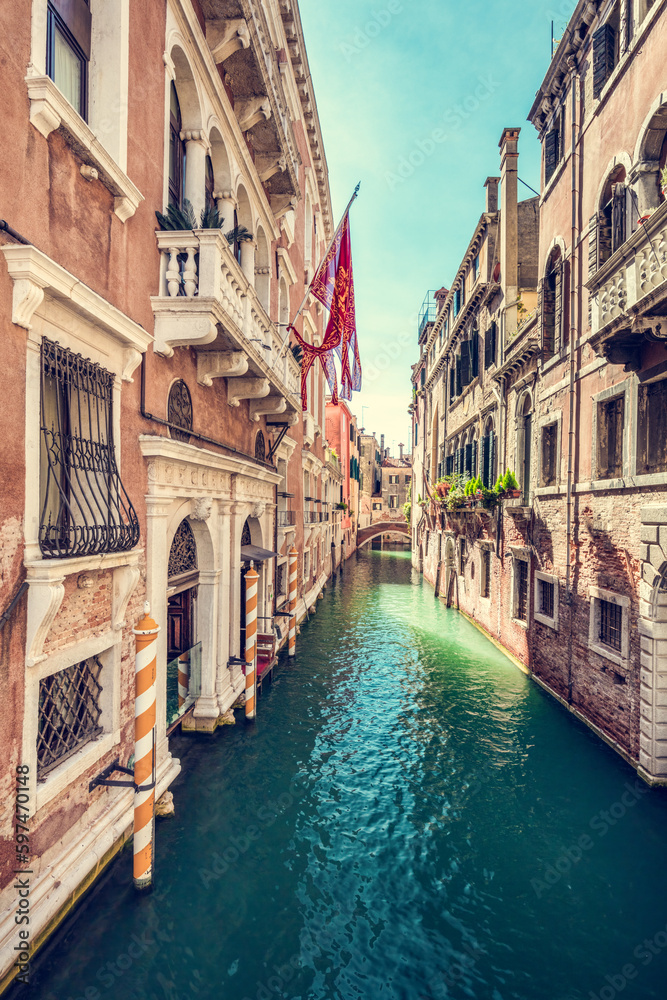 Scenic narrow canal in Venice, Italy.