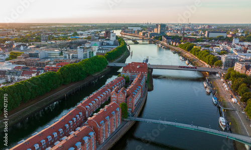 Bremen, Germany. Aerial View on a City of Bremen, Drone flight above the river Weser at sunset time