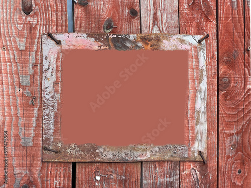 А rough frame on an old red fence, nailed down