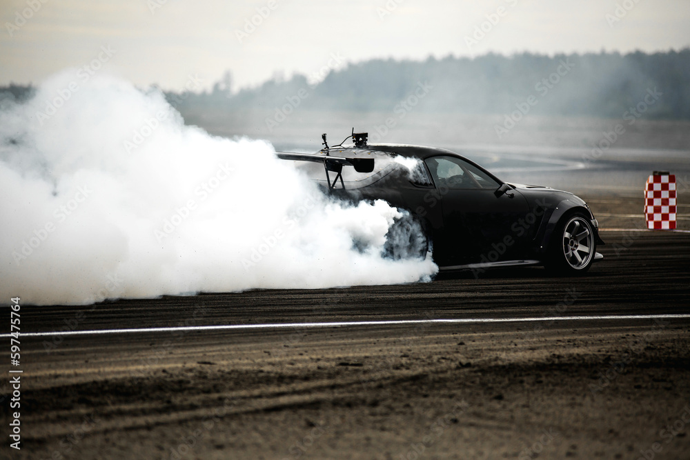 Sport car wheel drifting. Blurred of image diffusion race drift car with lots of smoke from burning tires on speed track. Sport concept, Drifting car concept