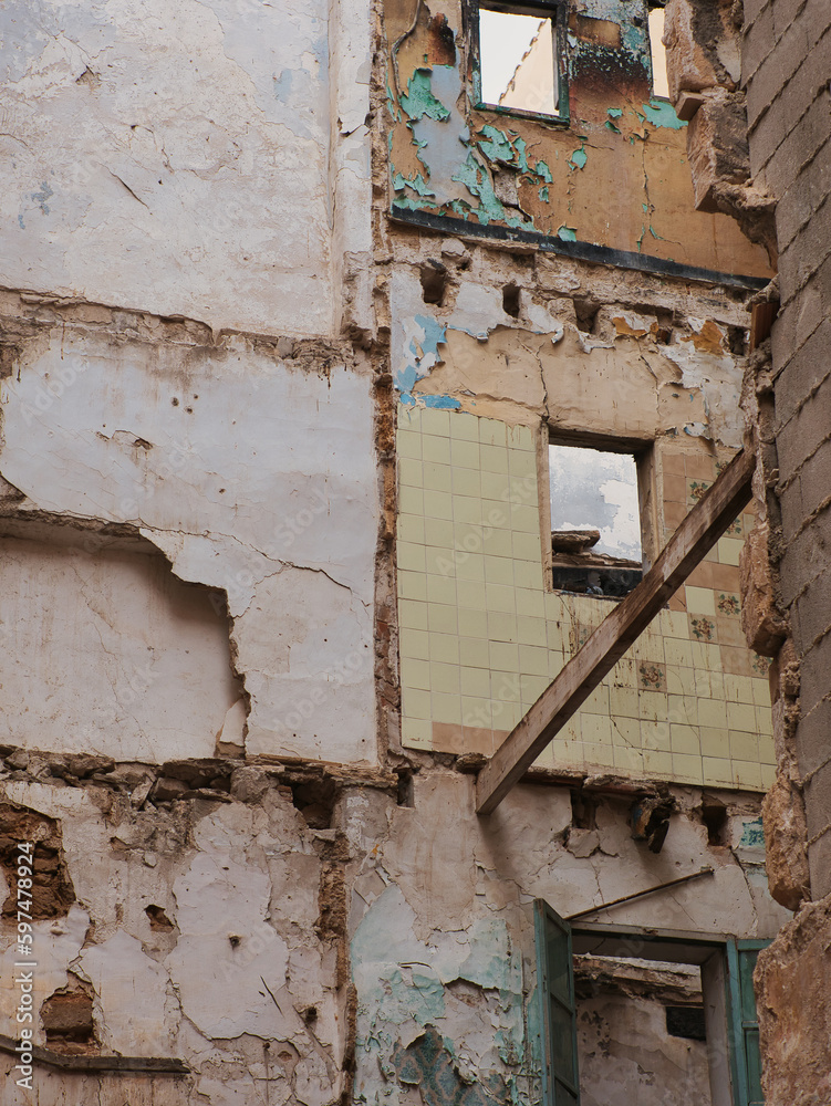 Demolition of a house, construction site, partial view. Wall and window of a destroyed house Demolition of a house, construction site, partial view. Wall and window of a destroyed house