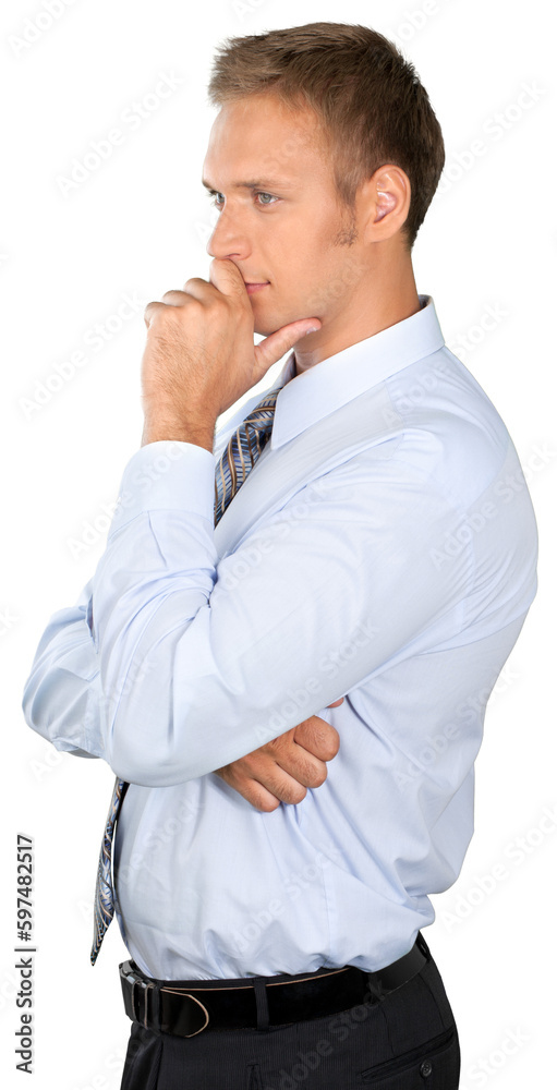 Professionally dressed male standing and thinking Professionally dressed male standing and thinking