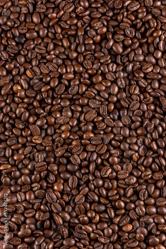 Roasted coffee beans filling the entire image. © AlvaroRT