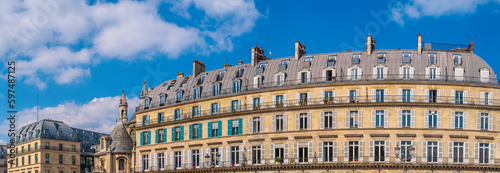 Paris peaceful cloudscape and city landmark buildings, the Louvre des Antiquaires, a place for artistis in France