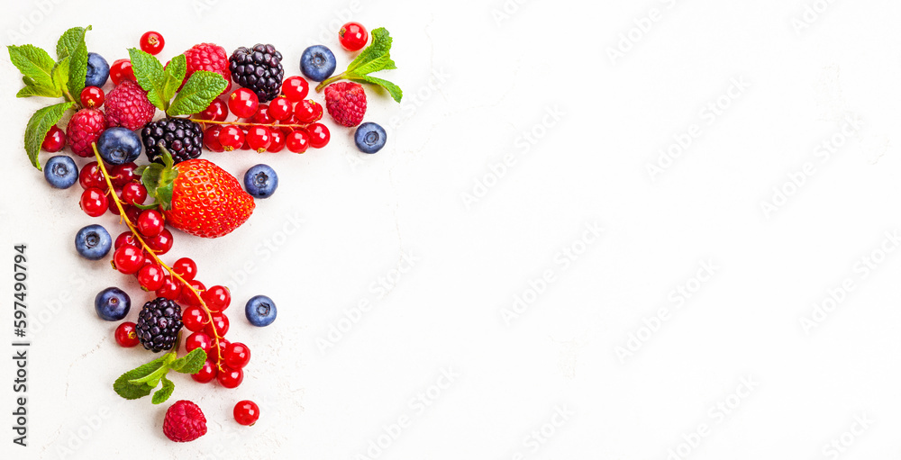 Sweet summer harvest of ripe berries on white background. Top view, copy space. Sweet summer harvest of ripe berries on white background. Top view, copy space.