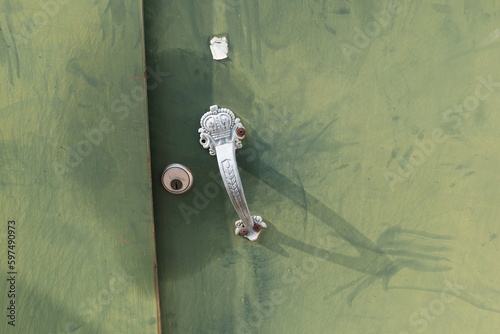 green door with door lock and doorknob design for security concept