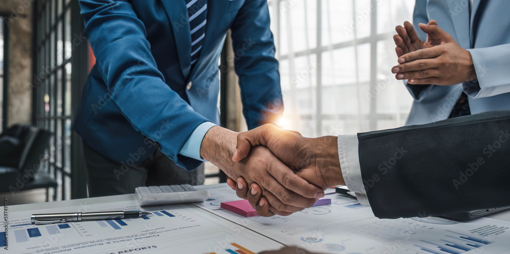 Business handshake for teamwork of business merger and acquisition,successful negotiate,hand shake,two businessman shake hand with partner to celebration partnership and business deal concept. - obrazy, fototapety, plakaty 