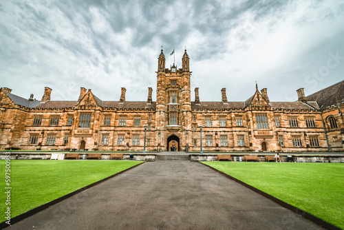 The facade of the historical University of Sydney Quadrangle in cloudy days