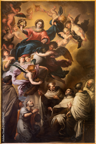 GENOVA, ITALY - MARCH 8, 2023: The painting of Madonna and sanits Carmelitans  in the church Chiesa di Nostra Signora del Carmine e Sant'Agnese by Raffaele Badaracco (1648 - 1726).