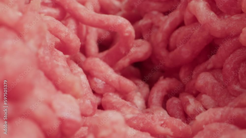 Raw minced meat macro probe lens, beef or pork red minced burger meat, close up tunnel rotation. Raw minced meat macro probe lens, beef or pork red minced burger meat, close up tunnel rotation.