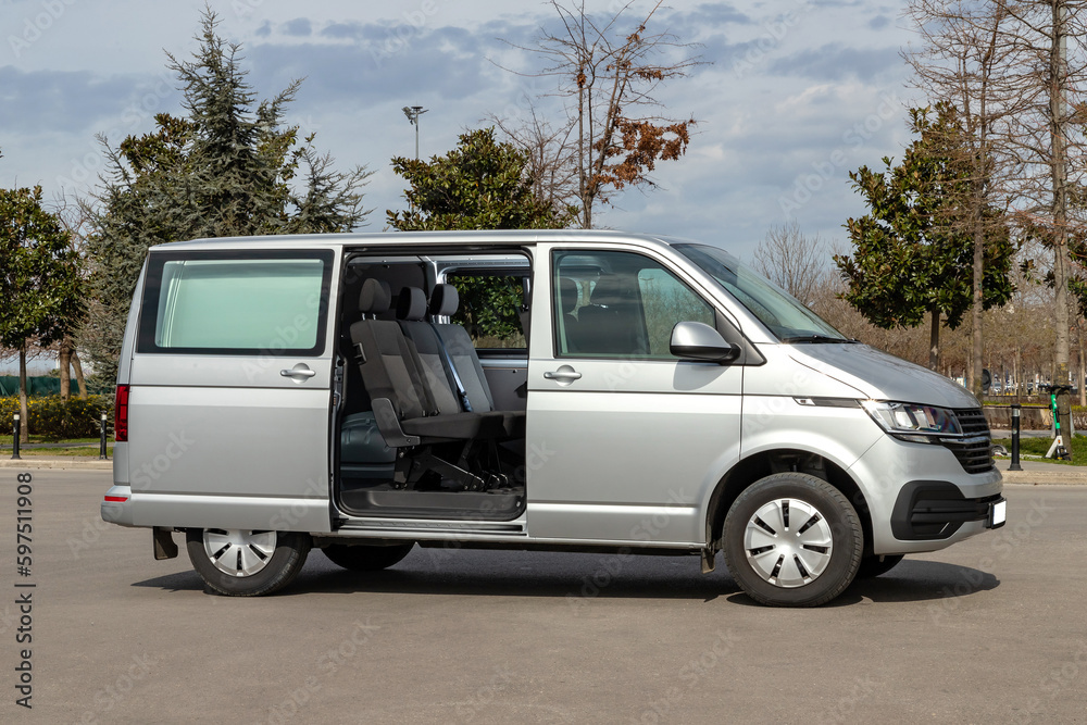 Fototapeta premium A grey van is parking in a car park, no logo.