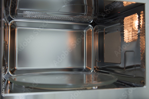 opened microwave inside oven close-up © storergv