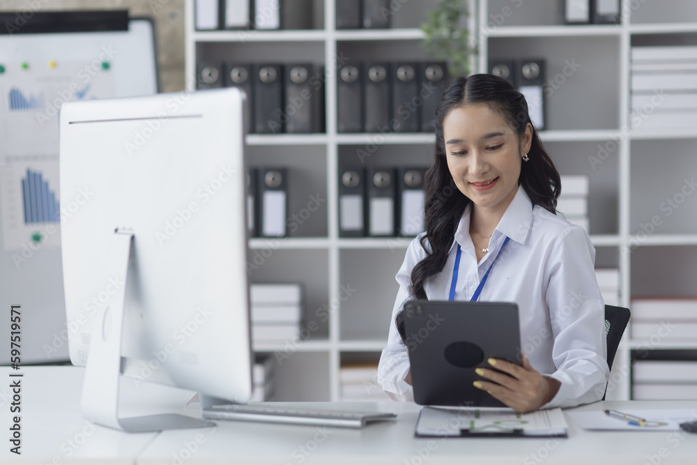 Asian businesswoman working on e-Commerce project marketing, Business and investment finance with growth graph. Asian businesswoman working on e-Commerce project marketing, Business and investment finance with growth graph.