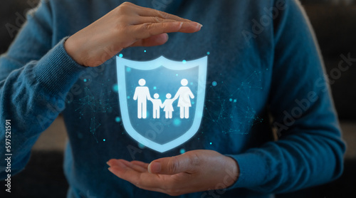 Human hand with family love care and holding shield guard protective gesture family, life, health, insurance, safe, real estate, support, insurance company, hospital, policy, life insurance concept