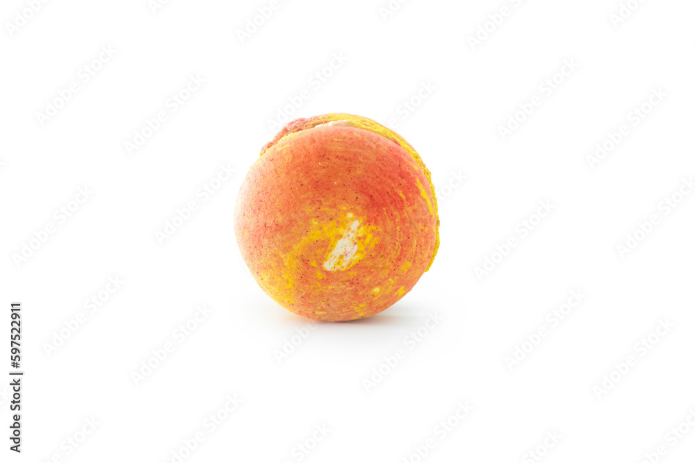 Orange French macaroon isolated on white background. Tasty colorful macaroons. French pastry made from egg whites. Culinary and cooking concept. Orange French macaroon isolated on white background. Tasty colorful macaroons. French pastry made from egg whites. Culinary and cooking concept.