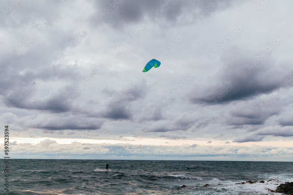 Kitesurfing training at sea nature sky in clouds storm Kitesurfing training at sea nature sky in clouds storm