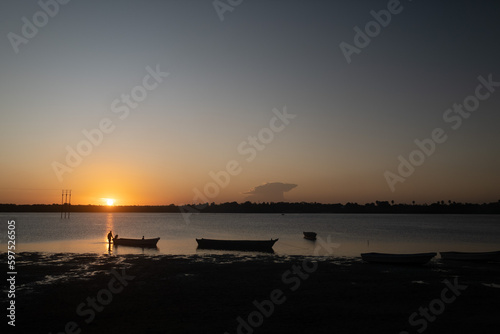 sunset over the Atlantic Ocean and fishing boats