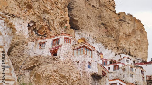 4K closeup shot of Phugtal Monastery made in a natural cave near Purne village in Zanskar, Ladakh India. Ancient monastery in a cave more than 2550 years ago in India. Monastery built inside the cave.