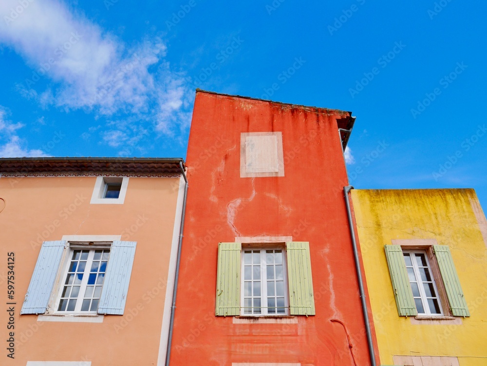 Colorful house facade in scenic Luberon village Roussillon in Provence, France