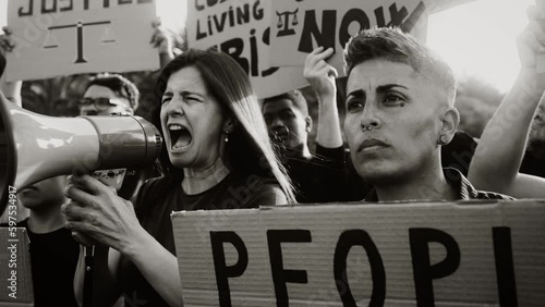 Demonstration of multiracial activists protesting against financial crisis and global inflation - Economic justice activism concept - Black and white editing