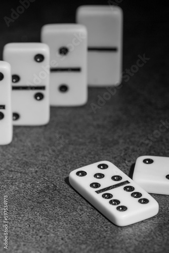 tiles of classic dominoes on a dark background