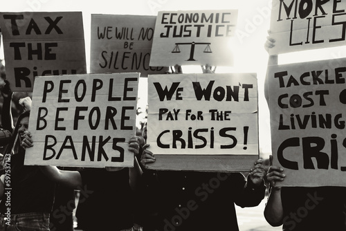 People protesting against financial crisis and global inflation - Economic justice activism concept - Black and white editing photo