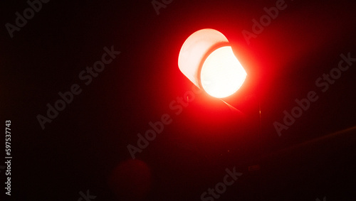 Close up red traffic light, redlight signal at night,. Represents to stop.