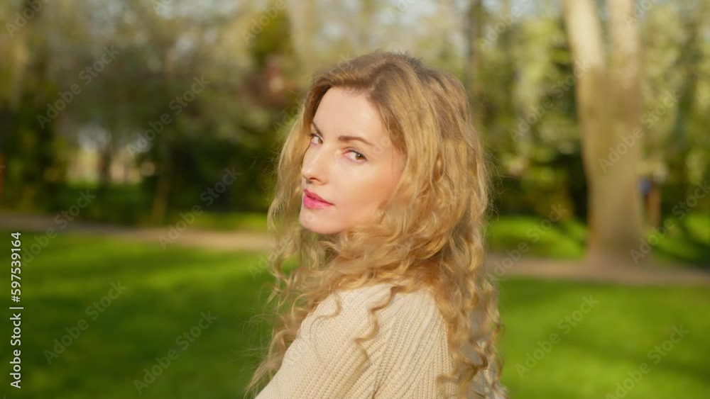 Rest, outdoor and joyful woman walking having fun smiling in park for health, peace, taking relaxing deep breath outside. Carefree female lady enjoying sunlight in nature, fresh air for energy. Rest, outdoor and joyful woman walking having fun smiling in park for health, peace, taking relaxing deep breath outside. Carefree female lady enjoying sunlight in nature, fresh air for energy.