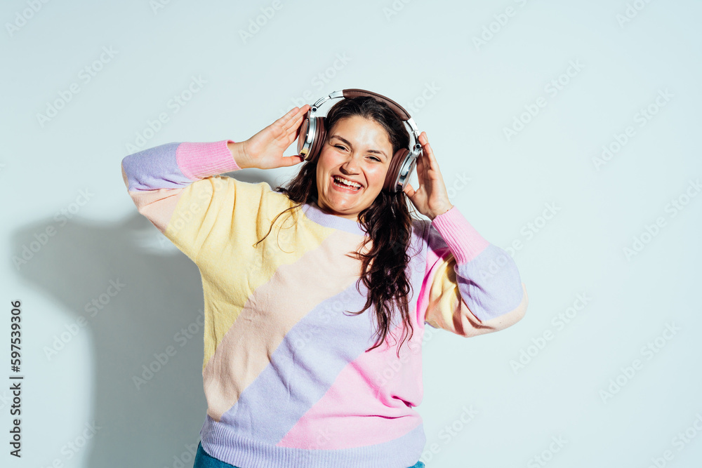Plus size woman model posing in studio and having fun. Plus size woman model posing in studio and having fun.