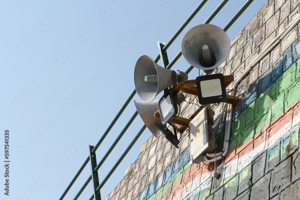 Obraz premium Loudspeakers on a wall in Rishikesh, India.
