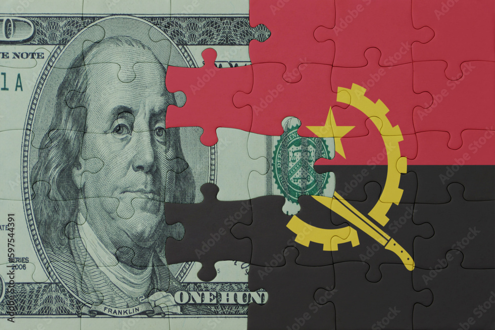 puzzle with the national flag of angola and dollar money banknote. macro.concept.