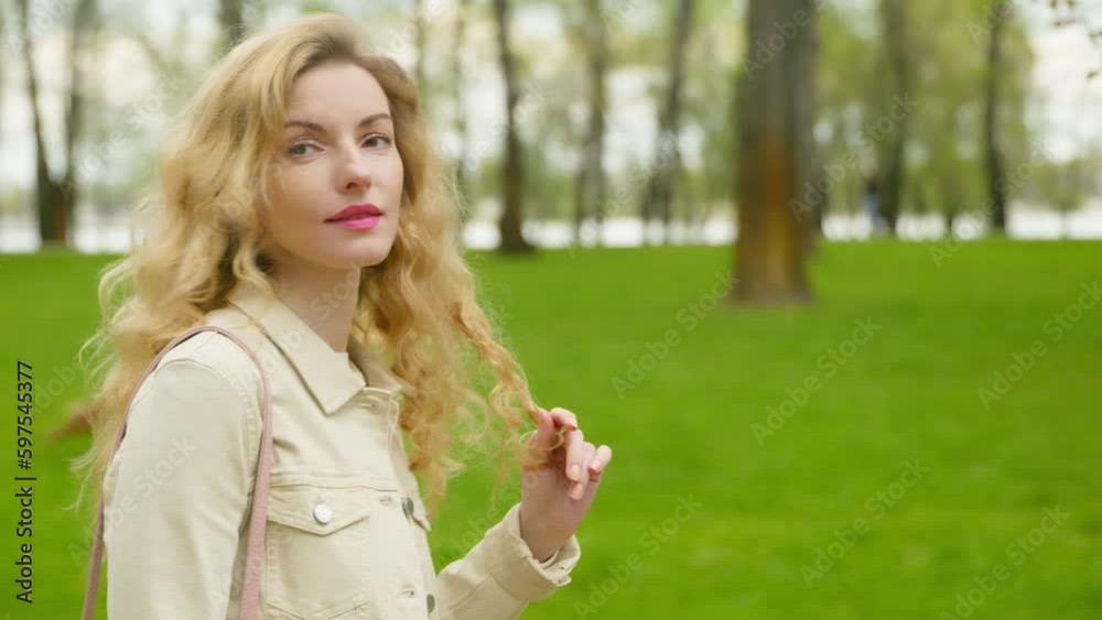 Walking, outdoor and woman in park for health, peace, rest and relax outside. Carefree positive smiling female lady walk in nature having fun, fresh air for balance, break, awareness and energy. Walking, outdoor and woman in park for health, peace, rest and relax outside. Carefree positive smiling female lady walk in nature having fun, fresh air for balance, break, awareness and energy.