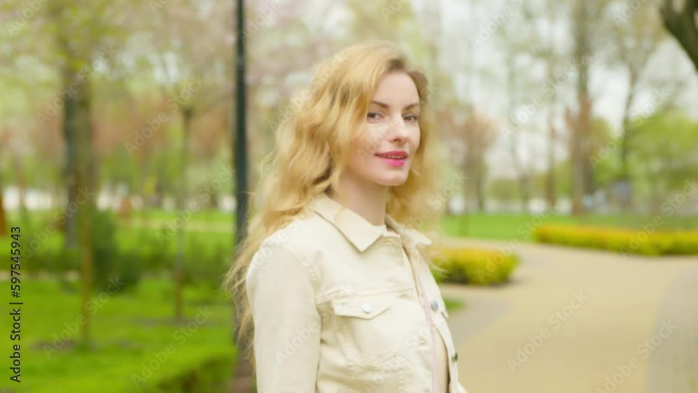 Walking, outdoor and woman in park for health, peace, rest and relax outside. Carefree positive smiling female lady walk in nature having fun, fresh air for balance, break, awareness and energy. Walking, outdoor and woman in park for health, peace, rest and relax outside. Carefree positive smiling female lady walk in nature having fun, fresh air for balance, break, awareness and energy.